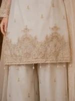 Off white 3 piece organza suit with gold-toned front work, palazzo and matching dupatta