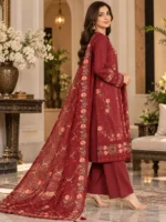 3 piece suit for women in maroon embroidered design shown in elegant side pose