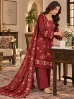 Embroidered cotton suit for women in maroon styled in an elegant lifestyle pose